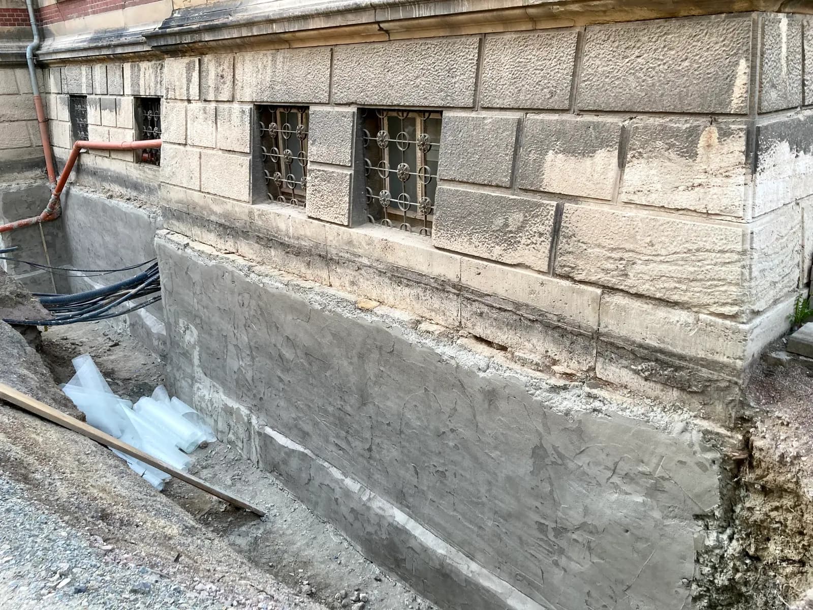 An excavated stone foundation wall prepared for waterproofing. Shown on the Wall cracks page for Fort Wayne, IN.